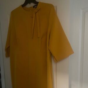 ELOQUII: Mustard yellow tie neck sheath dress